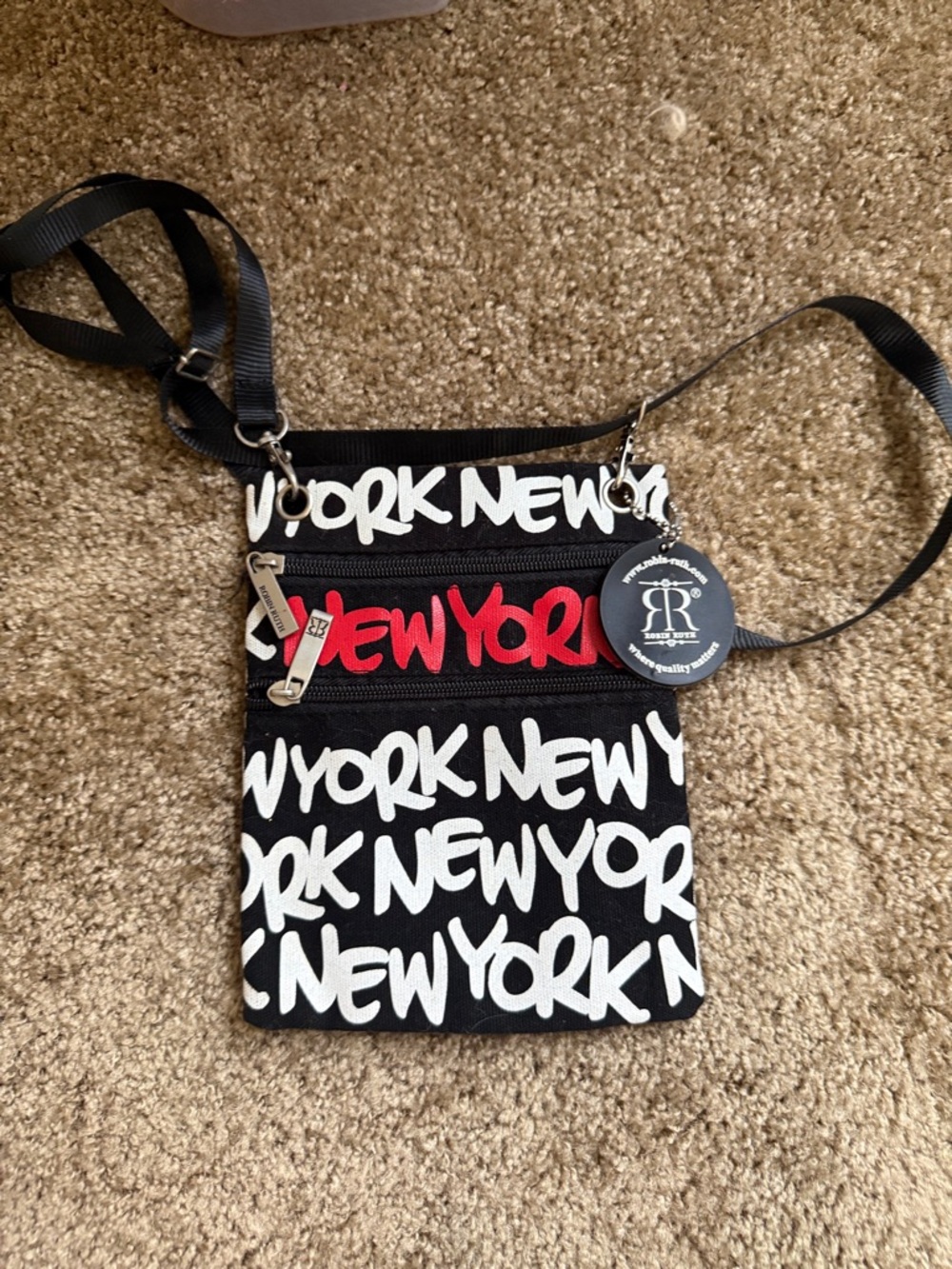 Robin Ruth Black Crossbody Bag with White Script and Red Accent